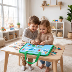 Two siblings building a Bible scene together on the felt board at a playroom table