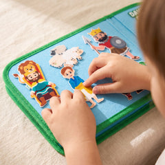 Close-up of a child's hands pressing a felt Bible character onto the felt board